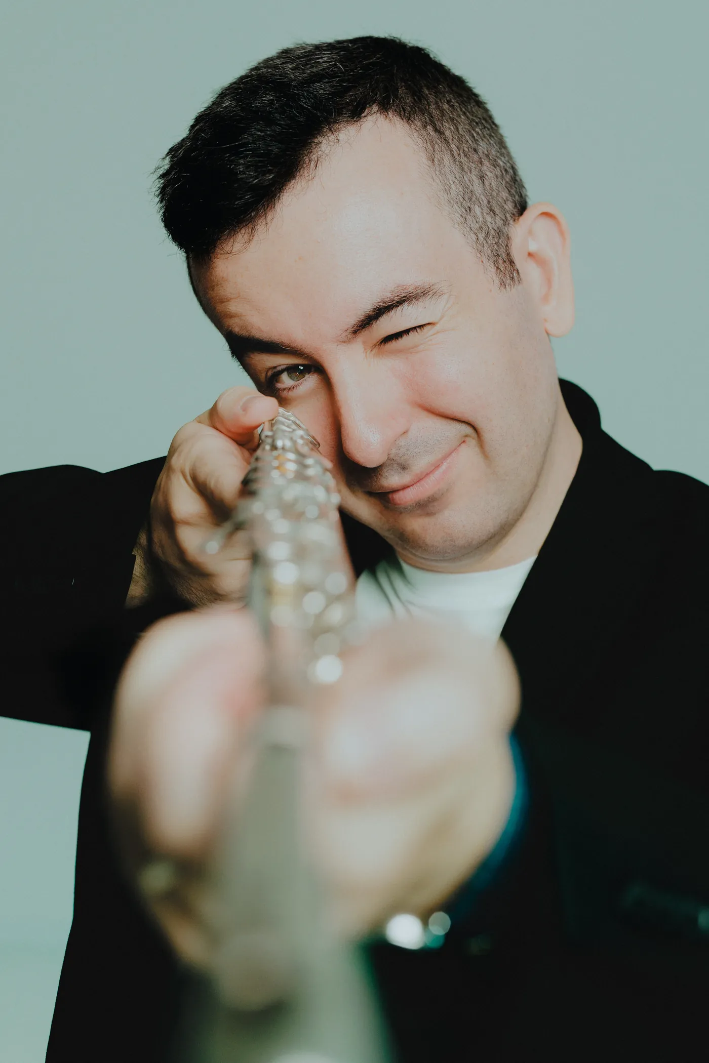 Alberto Acuña looking down the barrel of his flute