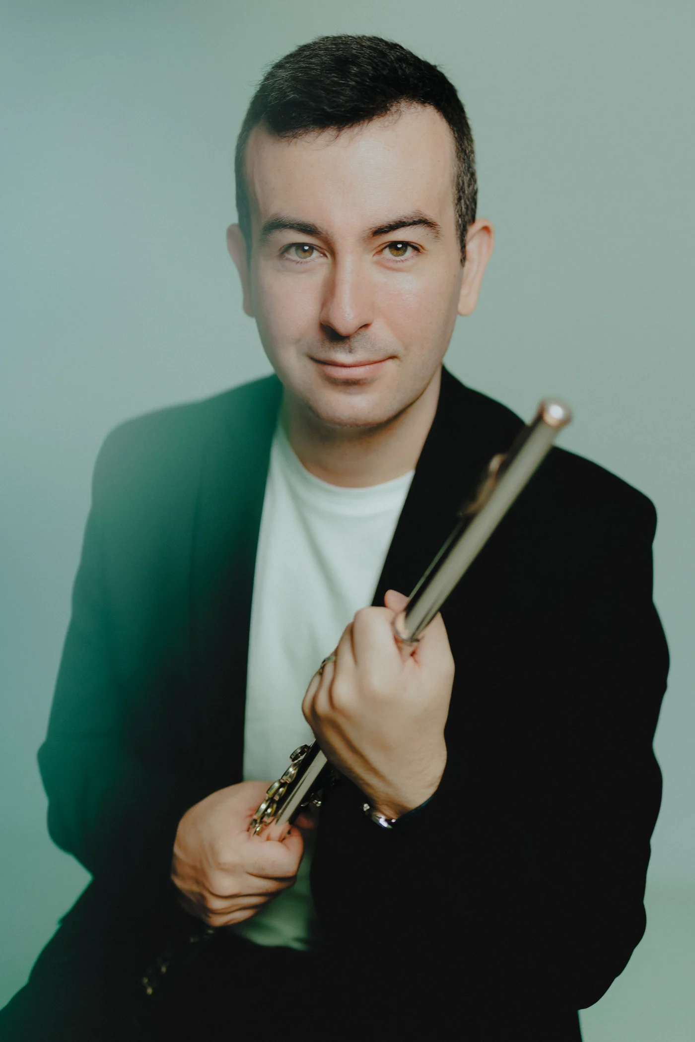 Alberto Acuña holding the headjoint of his flute